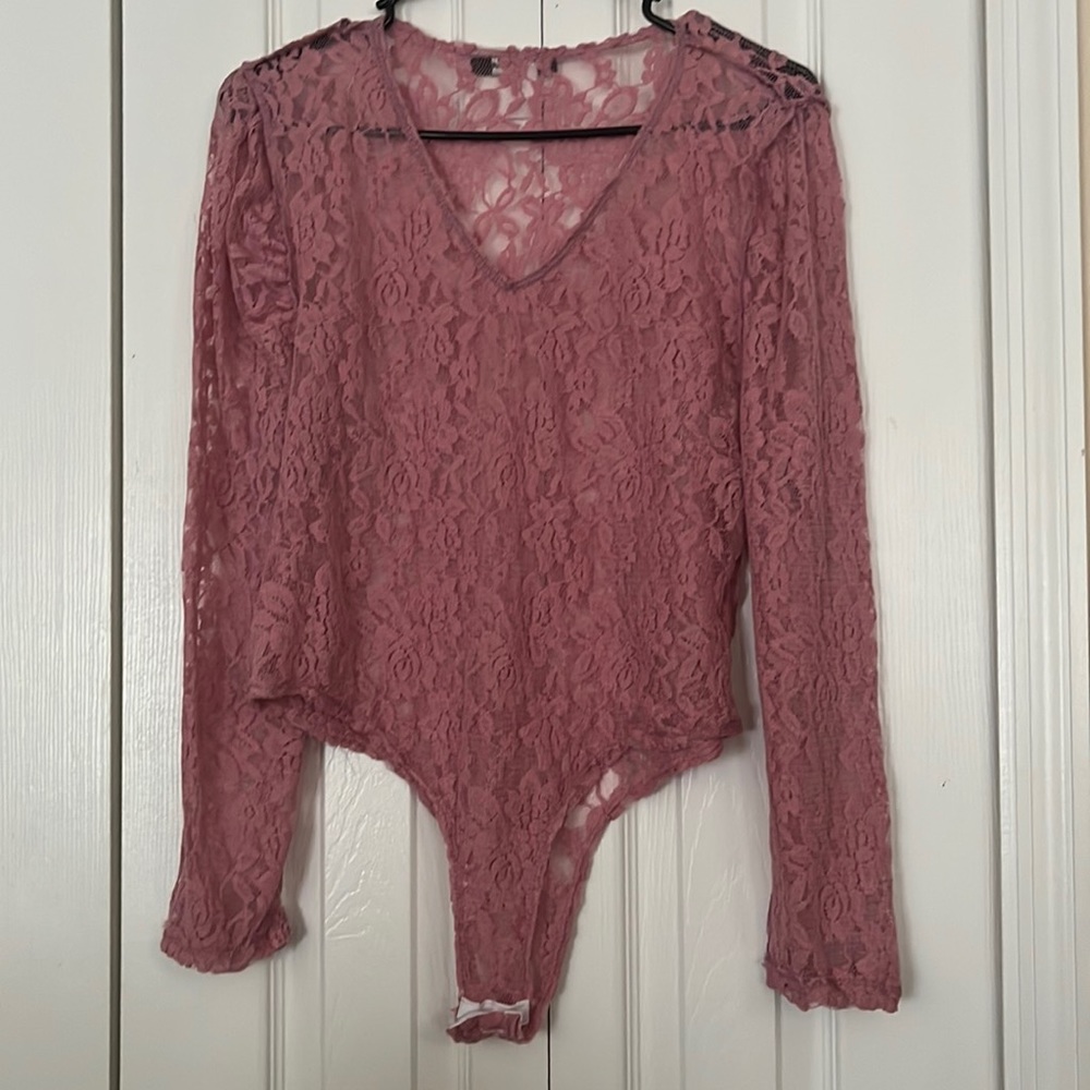 A laced body suit, softly worn new